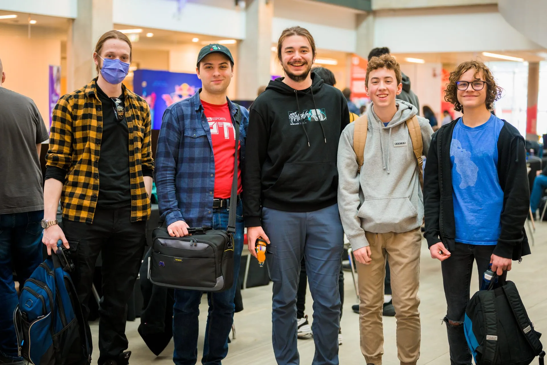 Five competitors pose together in the venue at Canakup 2023