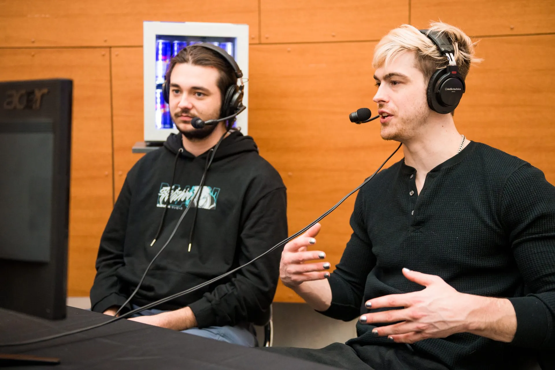 Two commentators in headsets cast a match at Canakup 2023
